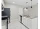 Modern kitchen featuring an island with stainless steel appliances and granite countertops at 600 Northern Way # 607, Winter Springs, FL 32708