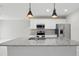 Contemporary kitchen featuring stainless steel appliances, island, and granite countertops at 600 Northern Way # 607, Winter Springs, FL 32708