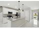 Bright kitchen with stainless appliances, granite countertops, and natural light at 600 Northern Way # 607, Winter Springs, FL 32708