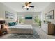 Bright main bedroom featuring stylish decor, natural light, and ensuite bathroom at 600 Northern Way # 607, Winter Springs, FL 32708