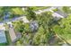 Overhead view of house and neighborhood, showcasing lush backyard trees and surroundings at 706 19Th St, Orlando, FL 32805