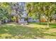 Expansive backyard featuring mature trees and lush greenery for a private outdoor retreat at 706 19Th St, Orlando, FL 32805
