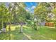 Spacious backyard featuring mature trees and a banana tree at 706 19Th St, Orlando, FL 32805