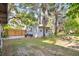 Wide backyard view with trees and the building at the rear at 706 19Th St, Orlando, FL 32805