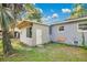 Back exterior of home features a renovated add-on with new windows and a modern door at 706 19Th St, Orlando, FL 32805
