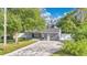 Inviting front of house featuring stylish landscaping, a brick driveway and fresh paint at 706 19Th St, Orlando, FL 32805