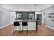 Modern kitchen features sleek cabinets, stainless steel appliances, and an island with seating at 706 19Th St, Orlando, FL 32805