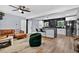 Open concept living room with modern decor flowing into the kitchen at 706 19Th St, Orlando, FL 32805