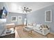 Open living room with white couch, neutral rug, and a flat screen television at 706 19Th St, Orlando, FL 32805