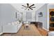 Living room featuring white couch, neutral rug, and a flat screen television at 706 19Th St, Orlando, FL 32805