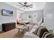 Living room featuring white couch, neutral rug, and a flat screen television at 706 19Th St, Orlando, FL 32805