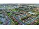 An aerial view shows a nice residential neighborhood with rows of similar houses and green trees at 814 Calabria Ave, Davenport, FL 33897