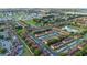 An aerial view shows a nice residential neighborhood with rows of similar houses and green trees at 814 Calabria Ave, Davenport, FL 33897
