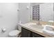 Clean bathroom with modern fixtures, a toilet, sink, vanity and decorative shower curtain at 814 Calabria Ave, Davenport, FL 33897
