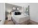 Cozy bedroom showcases a queen bed, side tables, and artwork, creating a welcoming space at 814 Calabria Ave, Davenport, FL 33897