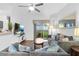 Bright living room featuring an entertainment center, backyard view, and comfortable furniture at 814 Calabria Ave, Davenport, FL 33897