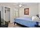 Bedroom features a ceiling fan, a closet, a window and a Bob Marley poster on the wall at 8709 Knightsbridge Ct # B, Kissimmee, FL 34747