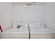 Laundry room features a washer, a dryer and shelves for storage of household products at 8709 Knightsbridge Ct # B, Kissimmee, FL 34747