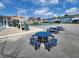 Community playground with slide, sand pit and picnic tables surrounded by apartments at 8709 Knightsbridge Ct # B, Kissimmee, FL 34747