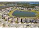 Community aerial view showcasing surrounding water features and lush landscaping at 8935 Sonoma Coast Dr, Winter Garden, FL 34787