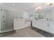 Bathroom featuring a walk-in glass shower, soaking tub, and double vanity with modern fixtures at 8935 Sonoma Coast Dr, Winter Garden, FL 34787
