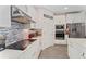 Kitchen featuring white cabinets, quartz countertops, stainless steel appliances, and gray backsplash at 8935 Sonoma Coast Dr, Winter Garden, FL 34787