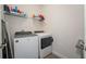 This laundry room is equipped with a modern washer and dryer set at 8935 Sonoma Coast Dr, Winter Garden, FL 34787