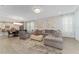 Spacious living room with open layout to dining area and kitchen, and neutral color palette at 8935 Sonoma Coast Dr, Winter Garden, FL 34787