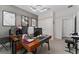 This office space features a large desk, accent wall and lots of natural light at 8935 Sonoma Coast Dr, Winter Garden, FL 34787