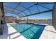Relax in this screened-in pool with a tanning ledge, spill-over spa, and lake views at 8935 Sonoma Coast Dr, Winter Garden, FL 34787