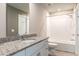 Bathroom with tiled floors, granite countertop, and a shower-tub combination at 1024 Desert Candle Dr, Ocoee, FL 34761