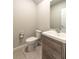 Compact bathroom with a modern vanity, tile flooring, and a toilet at 1024 Desert Candle Dr, Ocoee, FL 34761