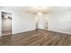 Bedroom featuring wood-look floor and doors to a closet and the bathroom at 1024 Desert Candle Dr, Ocoee, FL 34761