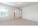 Carpeted bedroom with two entryways and natural light from the window at 1024 Desert Candle Dr, Ocoee, FL 34761