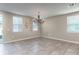 Bright dining room featuring tiled floor, a modern chandelier, and natural light at 1024 Desert Candle Dr, Ocoee, FL 34761
