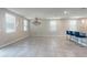 Dining room featuring tiled floor, a modern chandelier, and access to the kitchen at 1024 Desert Candle Dr, Ocoee, FL 34761