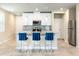 Modern kitchen with stainless steel appliances, granite countertops, and stylish bar stool seating at the island at 1024 Desert Candle Dr, Ocoee, FL 34761