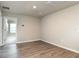 Wood-look floor living room with open entryway and recessed lighting at 1024 Desert Candle Dr, Ocoee, FL 34761