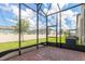 Screened patio with brick pavers offers great views of the backyard at 1024 Desert Candle Dr, Ocoee, FL 34761