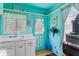 Unique blue kitchen featuring a white sink, and a back door at 105 N Florida Ave, Howey In The Hills, FL 34737