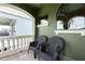 Private outdoor balcony with comfortable seating, perfect for relaxing and enjoying the view at 1156 Castle Pines Ct, Reunion, FL 34747