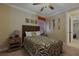 The second bedroom is styled with a unique zebra pattern and has neutral walls and trim at 1156 Castle Pines Ct, Reunion, FL 34747