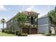 Stunning two-story home showcasing lush landscaping and an attached two-car garage at 1156 Castle Pines Ct, Reunion, FL 34747