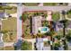Aerial view showcasing a residential property with a private pool and a well-maintained yard, enclosed in a red-lined boundary at 1301 Fahnstock St, Eustis, FL 32726