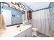This bathroom features a white vanity, a decorative mirror, and a tiled shower with star accents at 1301 Fahnstock St, Eustis, FL 32726