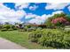 Charming home featuring lush landscaping, mature trees, and a well-maintained lawn at 1301 Fahnstock St, Eustis, FL 32726