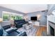 Comfortable living room with plenty of natural light, featuring hardwood floors and a cozy ambiance at 1301 Fahnstock St, Eustis, FL 32726
