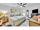 Bedroom with ceiling fan, wood floors, and neutral colors, with a window providing natural light at 137 N Spring Lake Dr, Altamonte Springs, FL 32714