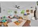 Bedroom with ceiling fan and two twin beds with colorful decor and hardwood style flooring at 137 N Spring Lake Dr, Altamonte Springs, FL 32714