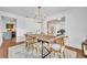 Spacious dining area with a rustic wooden table set, complemented by modern lighting and decor at 137 N Spring Lake Dr, Altamonte Springs, FL 32714